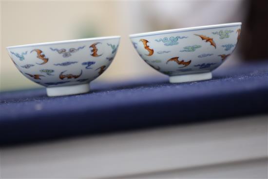 A pair of Chinese doucai bat bowls, Yongzheng mark, Republic period, D. 9.7cm, one bowl restored